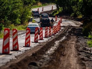 (Trent Nelson  |  The Salt Lake Tribune) Asphalt work has a lane closed in Lower Mill Creek Canyon in Salt Lake City on Tuesday, July 26, 2022.