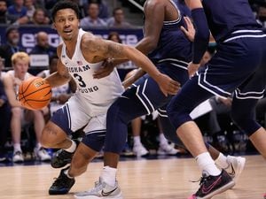 (Francisco Kjolseth | The Salt Lake Tribune) Brigham Young Cougars guard Te'Jon Lucas (3) pushes past the defense in basketball action between the Brigham Young Cougars and the Utah State Aggies at the Marriott Center in Provo, Wednesday, Dec. 8, 2021.