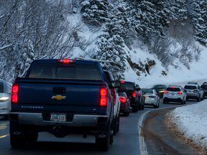 (Trent Nelson  |  The Salt Lake Tribune) Stalled traffic going up Big Cottonwood Canyon on Thursday, Dec. 29, 2022. A new shuttle service may help skiers reach the resorts.