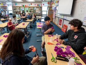(Leah Hogsten | The Salt Lake Tribune) North Layton Junior High students, from left, Madelyn Magana, Braedyn Martinez and Jonnathan Chavarria, cut paper circles on Oct. 6, 2022. State lawmakers are looking to get rid of letter grades that are currently assigned to every public school in the state each year.