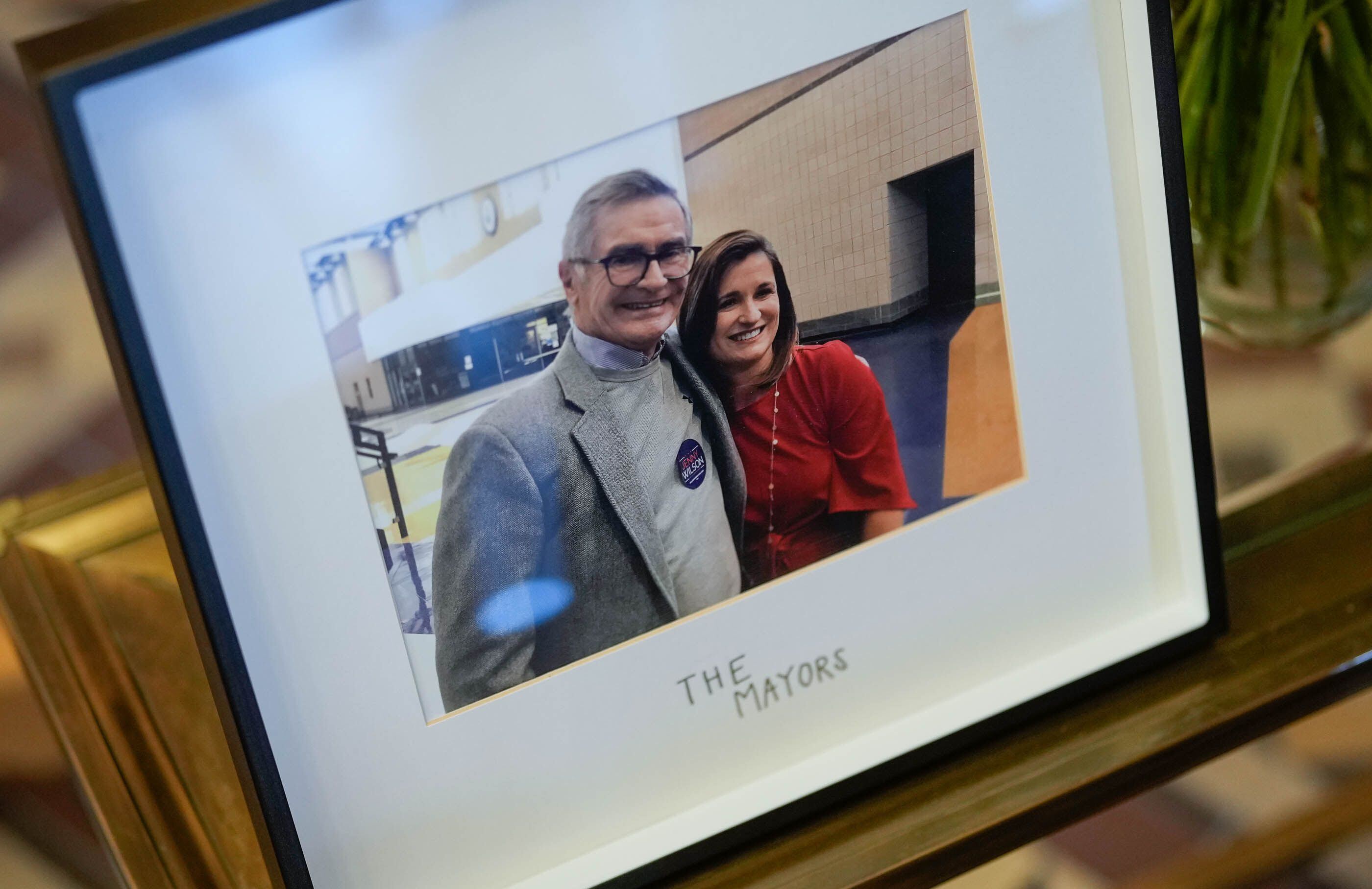 (Francisco Kjolseth | The Salt Lake Tribune) A photo of former Salt Lake City Mayor Ted Wilson and his daughter Salt Lake County Mayor Jenny Wilson on display at Salt Lake City Hall on Monday, April 15, 2024. Ted Wilson died last week at 84.