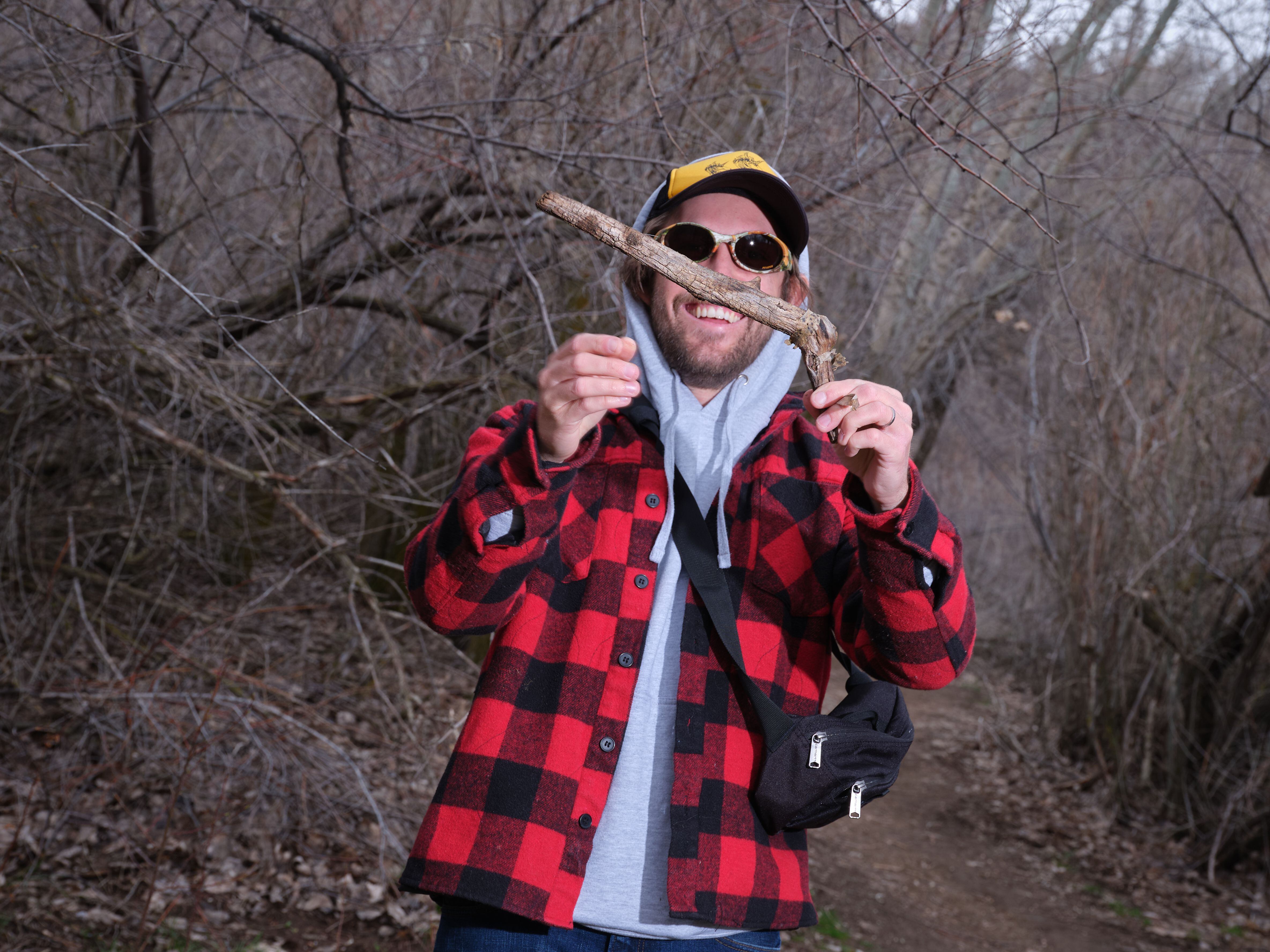 (Lindsay D'Addato | The New York Times) Boone Hogg, who with a friend found minor fame on Instagram by reviewing sticks, shows off Ôa good oneÕ in Ogden, Utah on March 30, 2024. What started as a wilderness jest has morphed into something slightly less tongue-in-cheek, for the act of finding, handling and appreciating a good stick seems to speak to oneÕs inner 5-year-old. 
