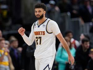 (David Zalubowski | AP) Denver Nuggets guard Jamal Murray gestures to the crowd after hitting a pair of free throws late in the second half of an NBA basketball game against the Utah Jazz, Saturday, Dec. 10, 2022, in Denver.
