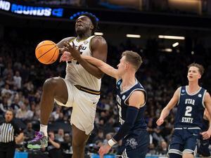 Missouri guard Kobe Brown (24) is fouled by Utah State guard Steven Ashworth (3) during the second half of a first-round college basketball game in the NCAA Tournament in Sacramento, Calif., Thursday, March 16, 2023. (AP Photo/José Luis Villegas)