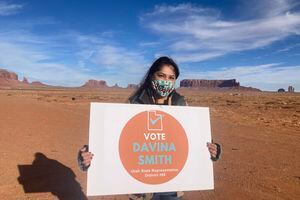 (Zak Podmore | The Salt Lake Tribune) Davina Smith holds a campaign sign in Monument Valley at an event announcing she'll be running for the Utah House of Representatives. Thursday, Dec. 16, 2021.