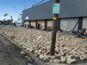 (Rick Egan | The Salt Lake Tribune) The grass park strip, where unsheltered people used to pitch their tents, has been replaced by giant rocks on the corner of 700 South and State Street, on Tuesday, Feb. 23, 2021.