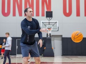 (Utah Athletics) New Runnin' Utes assistant Chris Burgess helps run a practice on campus on April 19, 2022. Burgess left BYU for his alma mater this spring, bringing with him a reputation as a recruiter who builds lasting relationships.