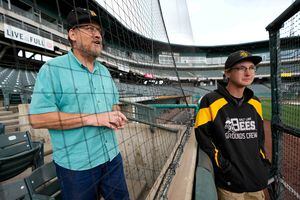 (Francisco Kjolseth | The Salt Lake Tribune) Jon Bray and his son Sam, 19, talk before a recent game between the Salt Lake Bees and the Albuquerque Isotopes on Tuesday, May 17, 2022. Through attending thousands of Triple-A, spring training and rookie league games, they have somehow done what most fans can only dream of: maneuver their way into the exclusive society of MLB.