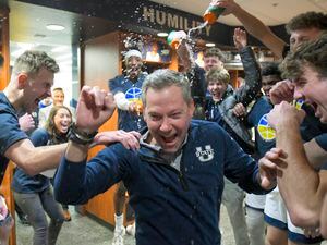 (Eli Lucero | The Herald Journal via AP) Utah State head coach Ryan Odom, center, celebrates with players in the locker room after defeating Nevada in an NCAA college basketball game Saturday, Feb. 18, 2023, in Logan, Utah.