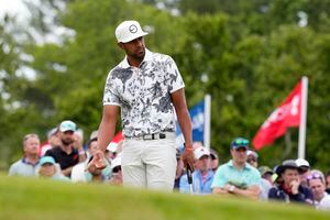 Tony Finau reacts to his putt on the seventh hole during the first round of the U.S. Open golf tournament at The Country Club, Thursday, June 16, 2022, in Brookline, Mass. (AP Photo/Charlie Riedel)
