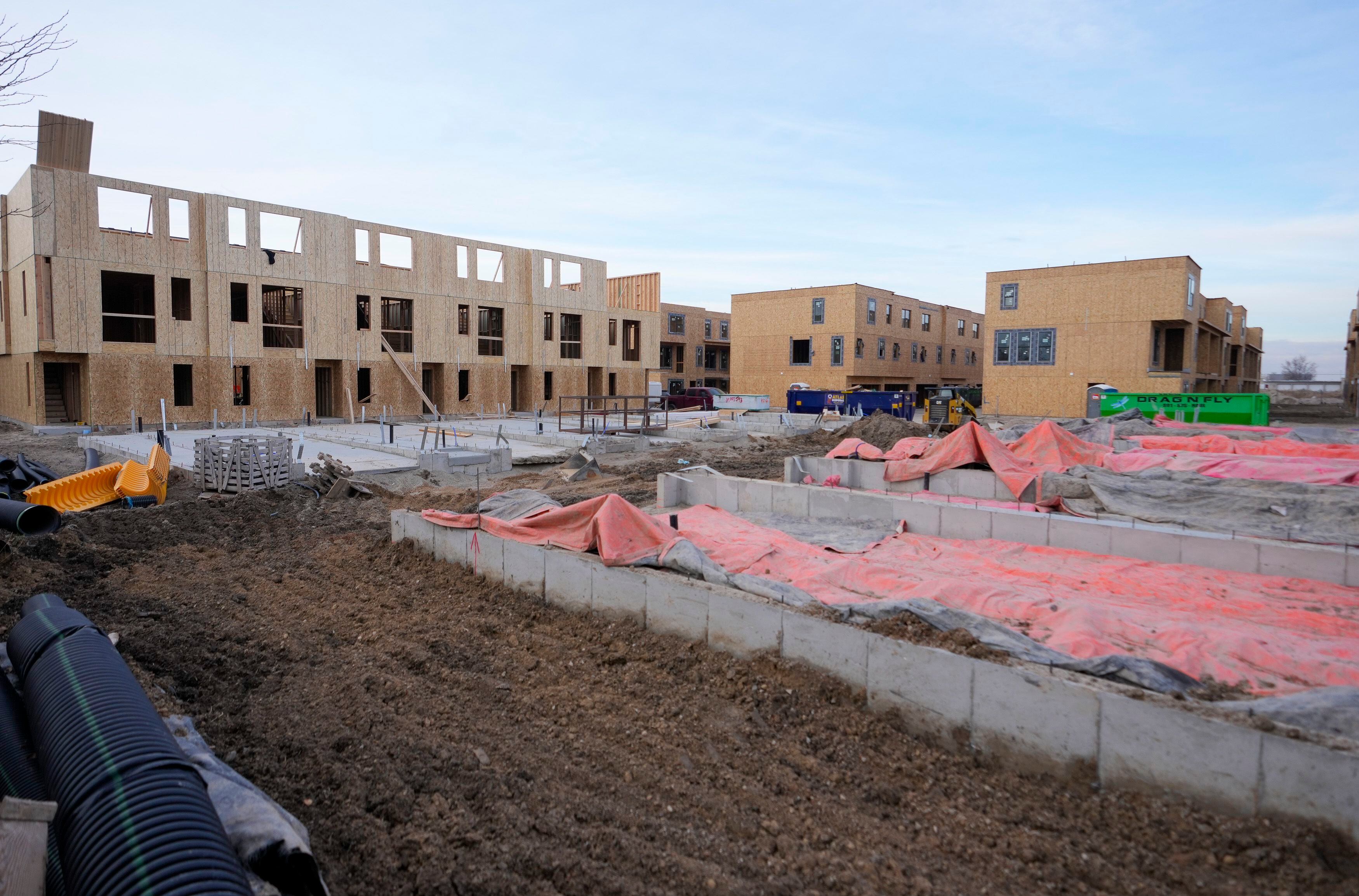 (Bethany Baker | The Salt Lake Tribune) Town homes stand partially built at a construction site along Redwood Road in Salt Lake City in December 2023. Affordable houses and larger rentals are needed to bolster families in Utah's capital.