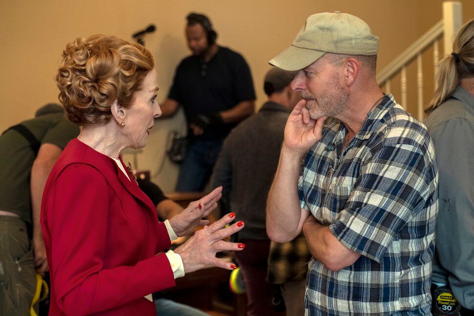 (Saeed Adyani | Netflix via AP) Actress Holland Taylor, left, speaking with Ryan Murphy on the set of 