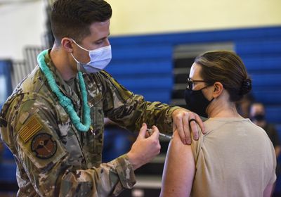 (U.S. Air Force Tech. Sgt. Anthony Nelson Jr./Department of Defense via AP) In this Feb. 9, 2021 photo provided by the Department of Defense, Hickam 15th Medical Group host the first COVID-19 mass vaccination on Joint Base Pearl Harbor-Hickam in Hawaii. Some Utah politicians are backing a provision of the NDAA that would end the military's COVID-19 vaccine mandate.