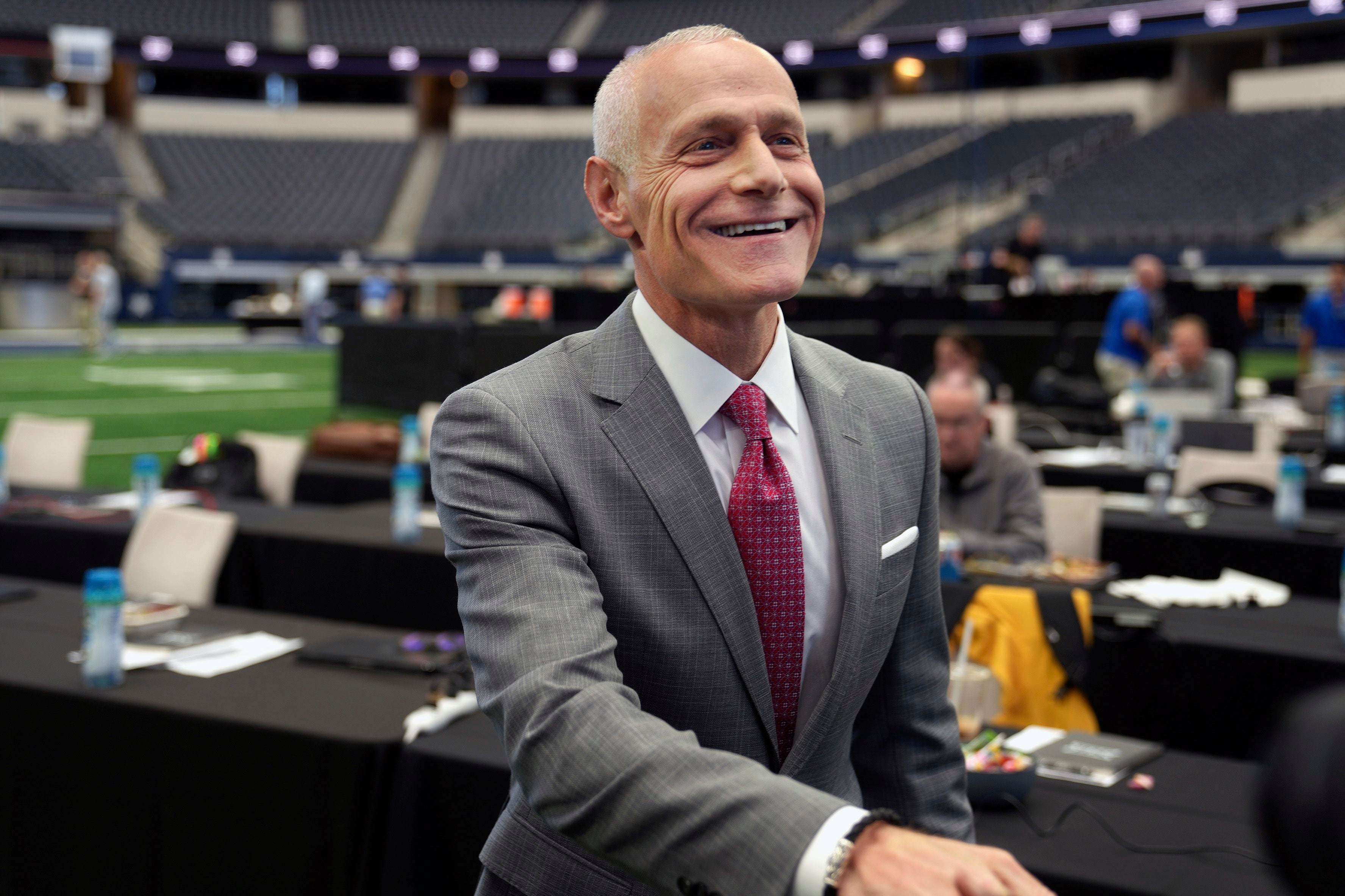 (LM Otero | AP) Big 12 Commissioner Brett Yormark smiles before speaking at the opening of the NCAA college football Big 12 media days in Arlington, Texas, July 12, 2023. When Colorado announced it was leaving the Pac-12 to return to the conference the Buffaloes jilted a dozen years ago, the Big 12 celebrated the reunion with a two-word statement released through Yomark: “They’re back.” 