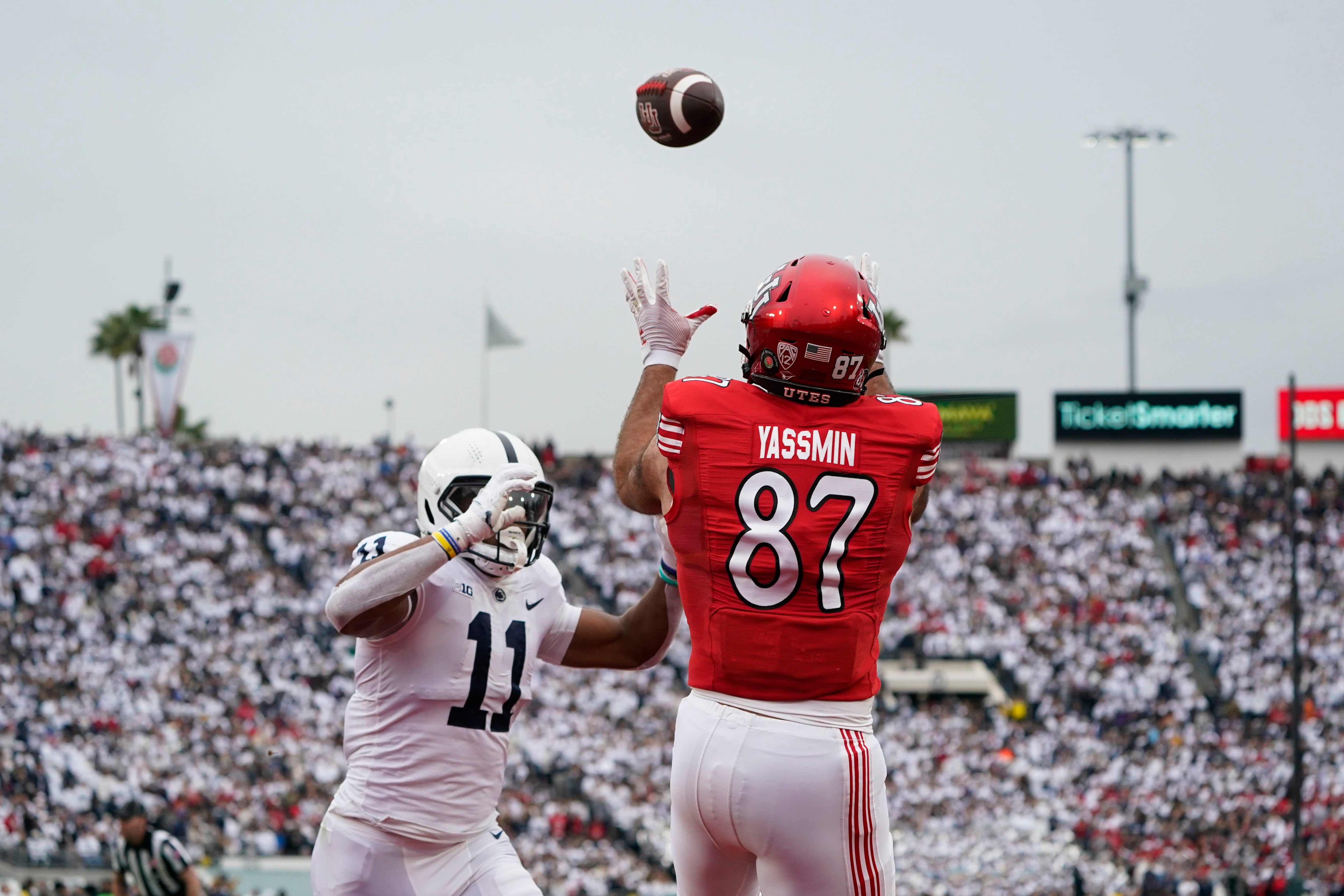 (Marcio Jose Sanchez | AP) Utah tight end Thomas Yassmin (87) catches a touchdown pass against Penn State linebacker Abdul Carter (11) during the first half in the Rose Bowl NCAA college football game Monday, Jan. 2, 2023, in Pasadena, Calif.