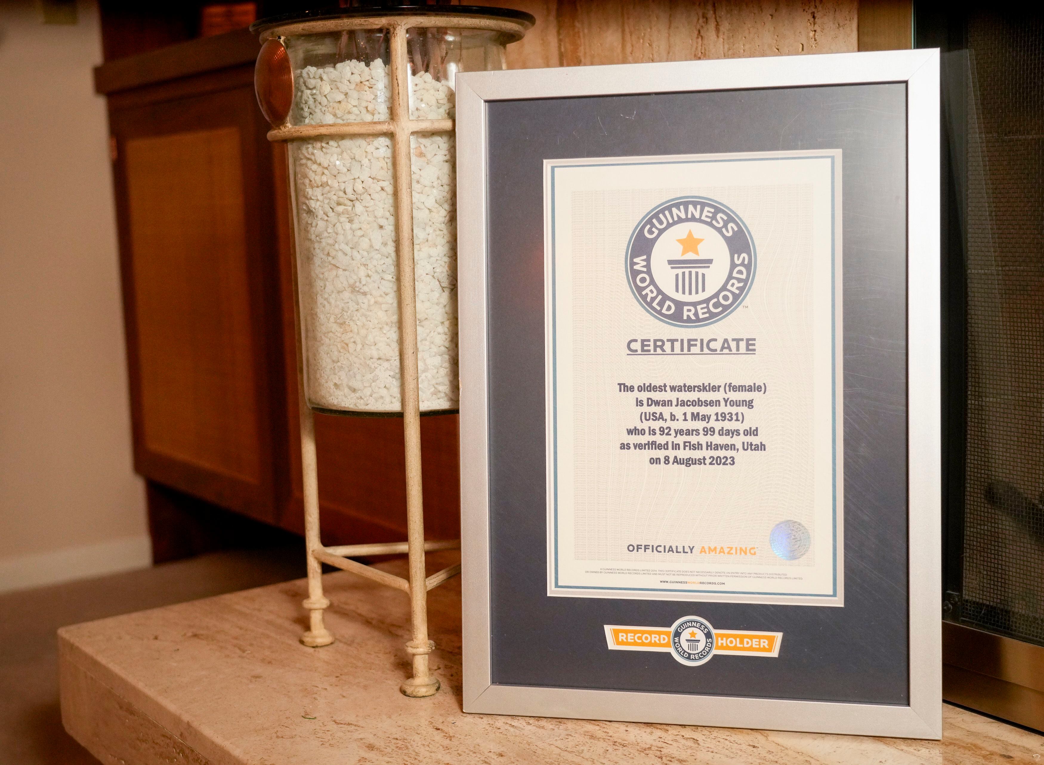 (Bethany Baker  |  The Salt Lake Tribune) Dwan Young's certificate from Guinness World Records for water skiing sits on her fireplace in her home in Salt Lake City on Wednesday, March 13, 2024.
