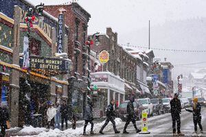 (Francisco Kjolseth | The Salt Lake Tribune) People visit historic Main Street in Park City on Thursday, Dec. 30, 2021. Sundance Film Festival on Wednesday, Jan. 5, 2022, canceled planned in-person screenings for the January event amid a recent spike in COVID-19 cases.