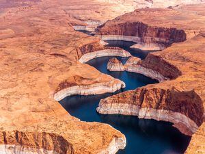 (Ecoflight) An aerial view of Navajo Canyon on Lake Powell, Thursday, April 14, 2022. The high water mark is near the boundary between Glen Canyon National Recreation Area and the Navajo Nation.