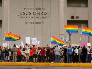(Trent Nelson  |  The Salt Lake Tribune) Protesters at a rally about BYU's changing position on “romantic behavior” by same-sex couples gather in front of the headquarters of The Church of Jesus Christ of Latter-day Saints in Salt Lake City on Friday, March 6, 2020.