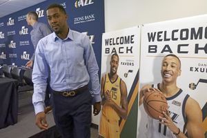 Utah Jazz's Derrick Favors walks off following an NBA basketball media availability with Dante Exum and Raul Neto, Friday, July 6, 2018, in Salt Lake City. Undergoing a roster makeover did not fit with what the Jazz have planned for the upcoming season. Rather than spend time and money trying to make a splash by bringing a high-profile free agent, the Jazz chose a different route announcing the free agent signings of Exum, Favors and Neto. (AP Photo/Rick Bowmer)
