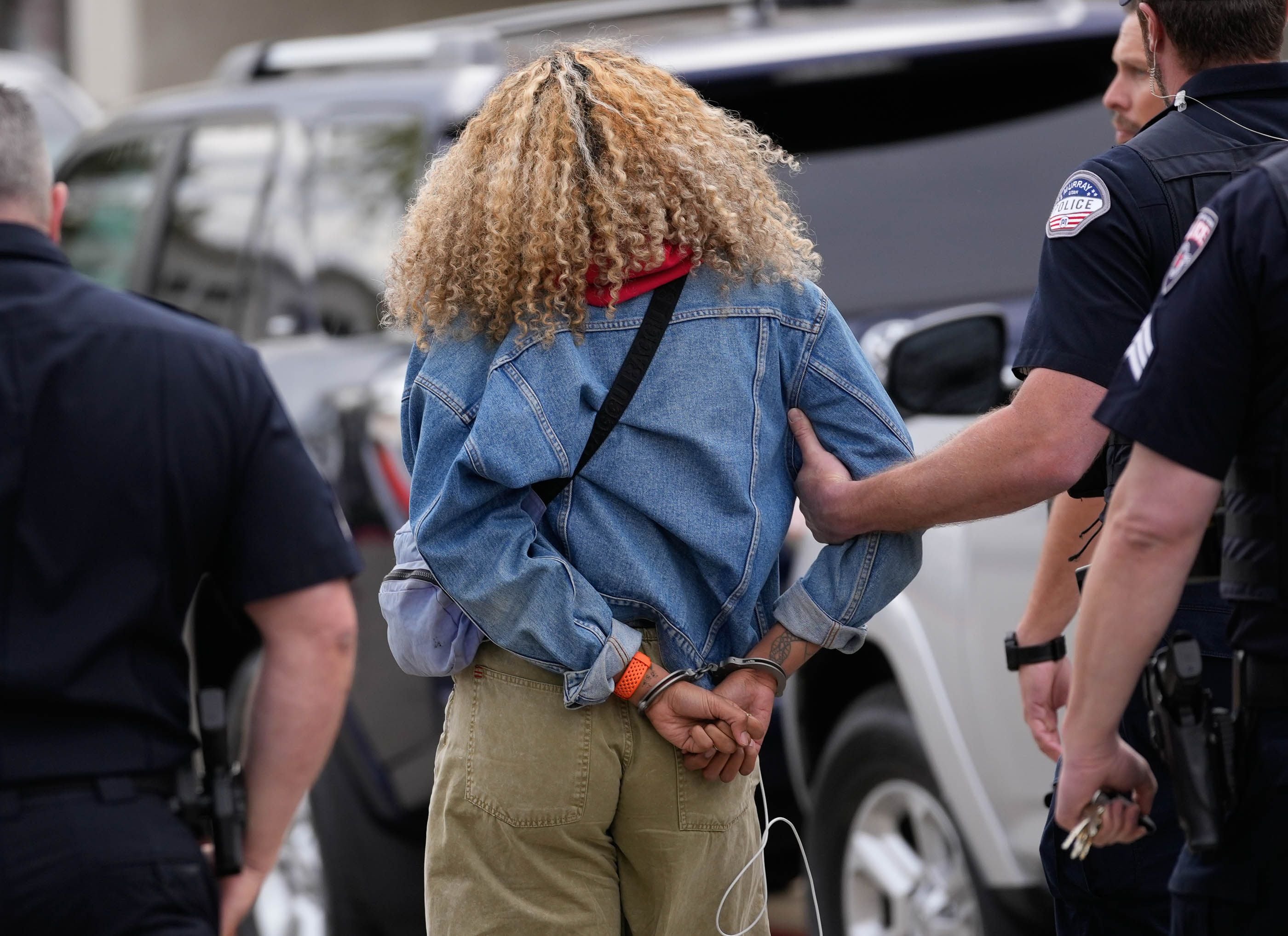 (Francisco Kjolseth  |  The Salt Lake Tribune) A pro-Palestine supporter is arrested outside the Huntsman Center on the University of Utah campus during commencement ceremonies on Thursday, May 2, 2024.