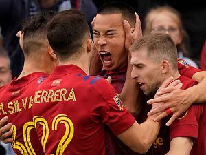 (Charlie Riedel | AP) Real Salt Lake forward Bobby Wood, center, celebrates with teammates after scoring the winning goal during the second half of an MLS soccer match against Sporting Kansas City Sunday, Nov. 28, 2021. Wood opened his 2022 account on Saturday in a 1-0 win over Seattle.