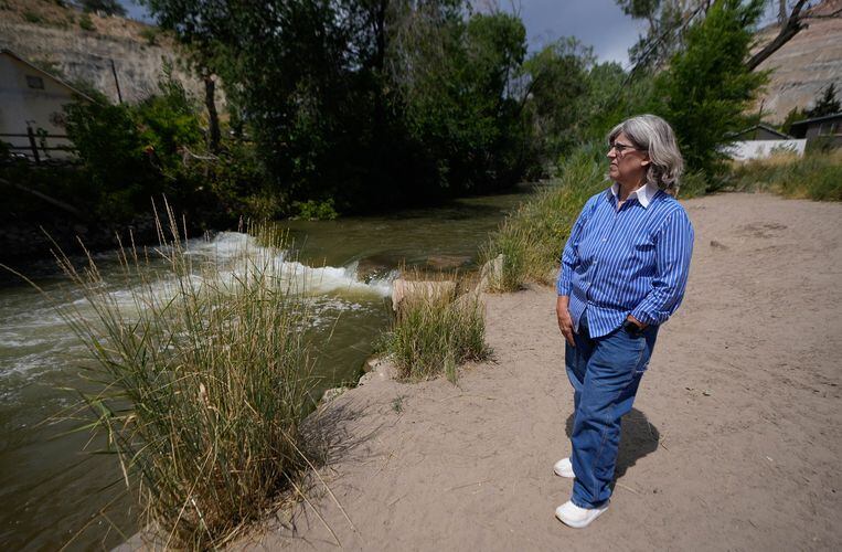 (Francisco Kjolseth | The Salt Lake Tribune) Helper mayor Lenise Peterman overlooks one of the many different stages of restoration that have taken place on the Price River adjacent to town on Wednesday, Aug. 16, 2023. With added beach areas, trash removal and fish friendly habitat areas, the river has become popular with tubers along with pedestrians and cyclist that use the adjacent trail. 