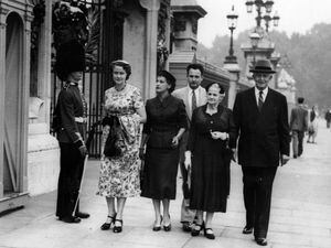 (The Salt Lake Tribune) Then-church President David O. McKay, right, outside Buckingham Palace in London with his family and secretary Clare Middlemiss, left, during a Tabernacle Choir tour of Europe in August 1955.