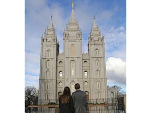 (Rick Bowmer | AP) A couple look at the Salt Lake Temple in 2019. A Latter-day Saint blogger notes that all marriages are mixed-faith relationships, since everyone's faith is ultimately unique to the individual.