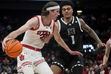 (Bethany Baker  |  The Salt Lake Tribune) Utah Utes center Branden Carlson (35) drives to the basket as Hawaii Warriors forward Justin McKoy (1) tries to steal at the Delta Center in Salt Lake City on Thursday, Nov. 30, 2023.