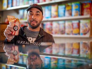 (Trent Nelson  |  The Salt Lake Tribune) Chris Burns, owner of Cereal Killerz Kitchen in Salt Lake City, shows an ice cream treat with cereal and a Pop-Tart. Cereal restaurants are a growing trend in sweet treats in Utah.
