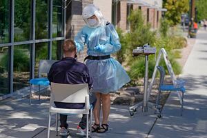 (Rick Bowmer | AP) Clay Harris receives a COVID-19 test outside the Salt Lake County Health Department on Friday, July 22, 2022.