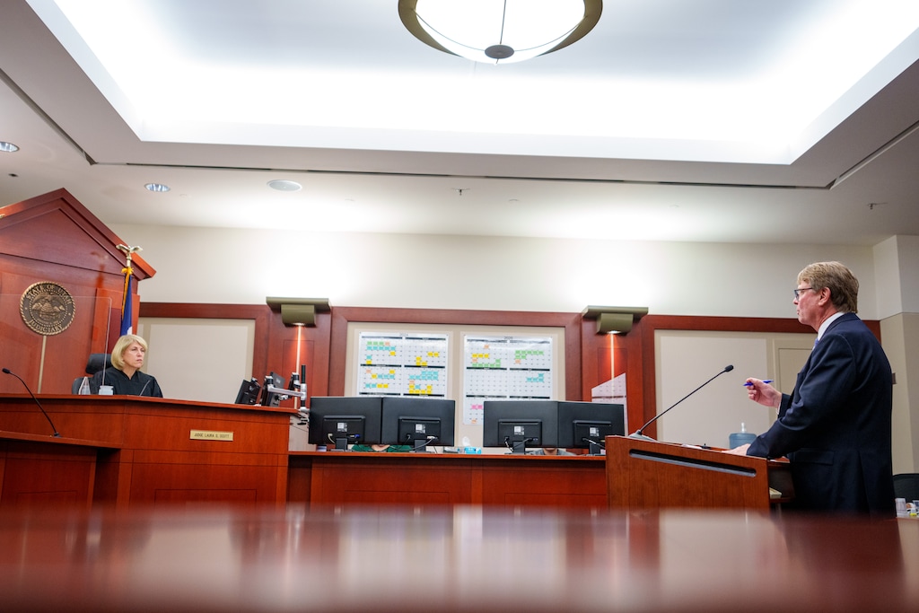 (Trent Nelson  |  The Salt Lake Tribune) Scott Ryther, right, an attorney for the Utah Attorney General's Office, speaks to Utah 3rd District Judge Laura Scott during a December 2024 hearing on Utah Education Association's lawsuit against the Utah Fits All Scholarship (or voucher) program.
