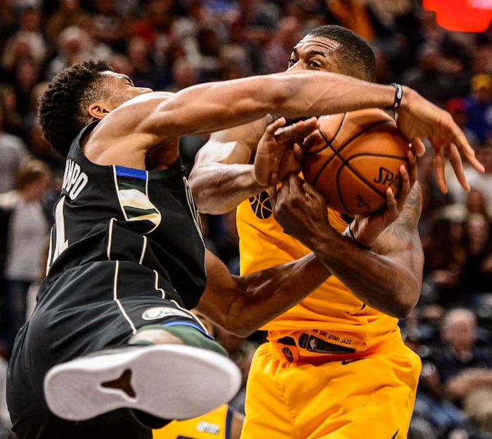 (Trent Nelson | The Salt Lake Tribune)  Utah Jazz forward Derrick Favors (15) blocks a shot by Milwaukee Bucks forward Giannis Antetokounmpo (34) as the Utah Jazz host the Milwaukee Bucks, NBA basketball in Salt Lake City Saturday November 25, 2017.