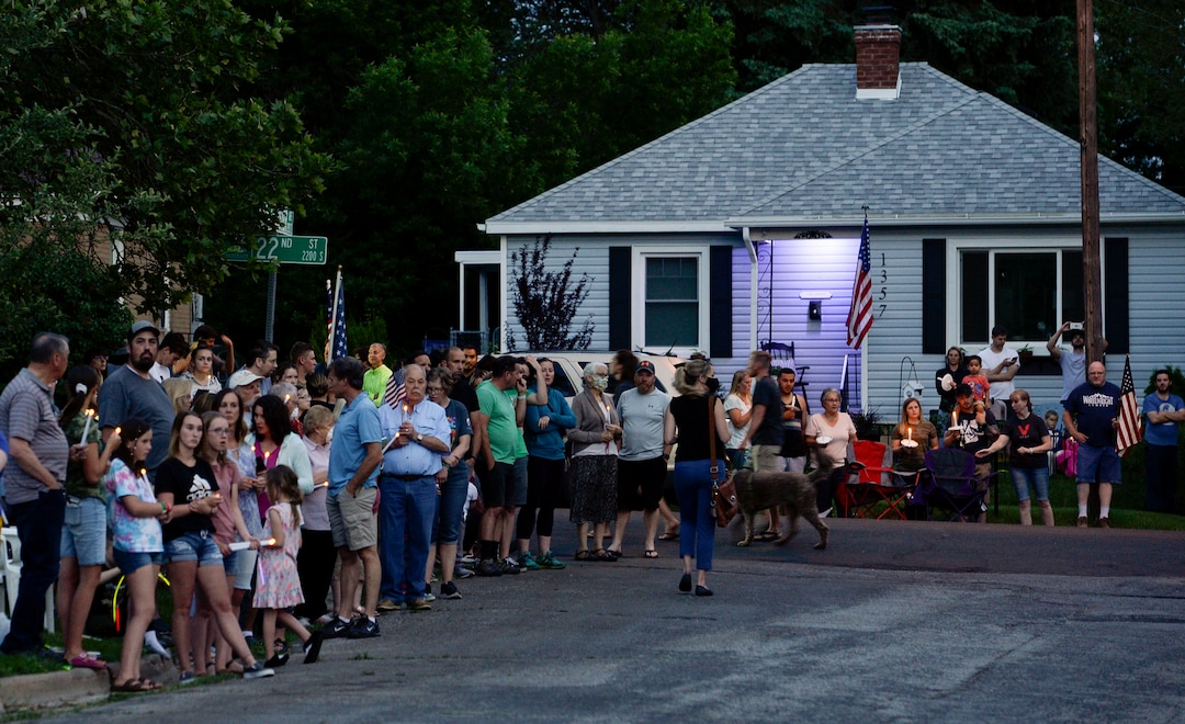 (Leah Hogsten  |  The Salt Lake Tribune) Friends and supporters lined the neighborhood of Officer Nate Lyday's childhood home on Custer Avenue in Ogden prior to the Memorial Procession and Community Vigil in honor of Lyday's life. The procession made its way through five other Ogden landmarks before ending at Lindquist Field.