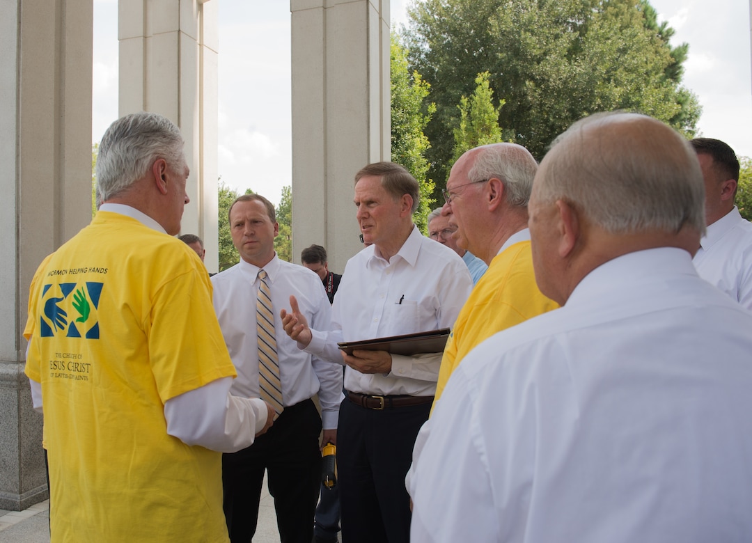 (Rachel Molenda  |  The Salt Lake Tribune) Houston Temple President Marshall Hayes, center, explains some of the needs of Houston-area stakes, or groups of congregations, to Dieter F. Uchtdorf, second counselor in the governing First Presidency, left.