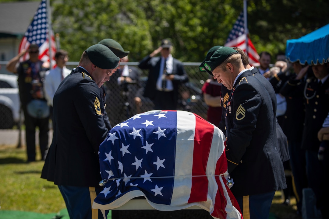 (Ben Dorger | Standard-Examiner via AP) Military personnel carry the remains of Army Sgt. 1st Class Elliott Robbins to his final resting place at Ben Lomond Cemetery on Thursday, July 18, 2019. Robbins died in a non-combat incident on June 30 while serving in Afghanistan.