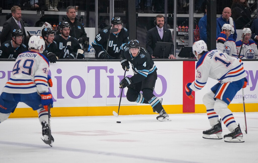 (Bethany Baker | The Salt Lake Tribune) Utah Hockey Club defenseman Juuso Valimaki (4) brings the puck down the ice as Edmonton Oilers center Mattias Janmark (13) and defenseman Ty Emberson (49) defend during the game at the Delta Center in Salt Lake City on Friday, Nov. 29, 2024.
