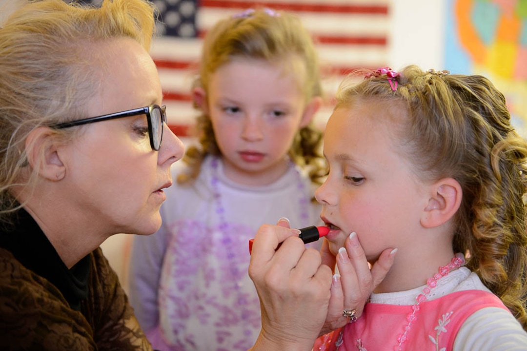 (Trent Nelson | The Salt Lake Tribune)  A princess party was thrown for several young FLDS girls in Colorado City, Ariz., Friday March 16, 2018, as a reward for reading books. Before the party, Christine Marie Katas, left, of Voices for Dignity emphasized the importance of education to Lolly, center, and Kathy Bistline while giving them their first experience with makeup.