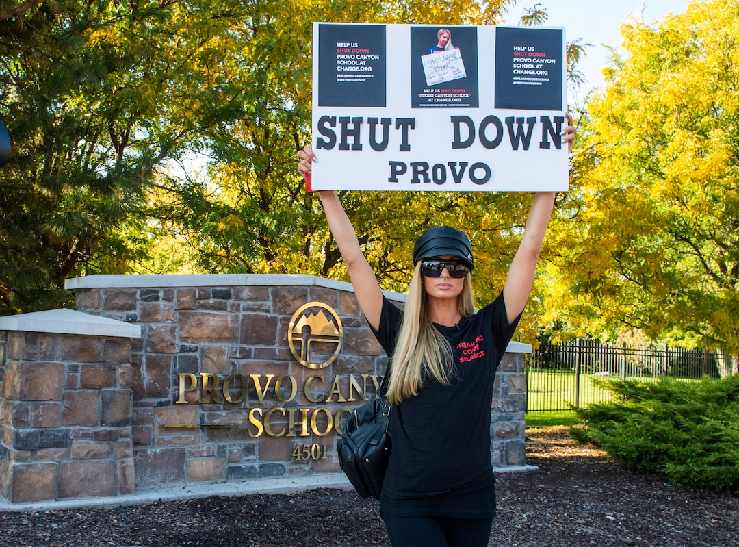 (Rick Egan  |  The Salt Lake Tribune)    Paris Hilton poses for a photo in front of the Provo Canyon School, during a rally and march calling  for the closure of Provo Canyon School, a residential treatment center in Utah she attended when she was a teen, on Friday, Oct. 9, 2020.
