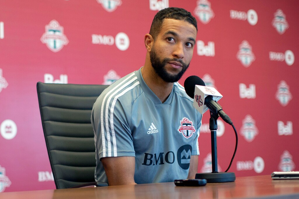 FILE - In this Nov. 13, 2019, file photo, Toronto FC soccer player Justin Morrow speaks to the media during an end of season availability in Toronto. A group of African American Major League Soccer players have formed a coalition to address systematic racism in their communities and bring about change within the league. The coalition is the result of an Instagram group formed after the death of George Floyd at the hands of Minneapolis police, which spawned a wave of nationwide protests against racism and policy brutality. Started by Toronto FC defender Justin Morrow, the group grew to some 70 MLS players, who decided to act and the Black Players Coalition of MLS was born. (Chris Young/The Canadian Press via AP, File)
