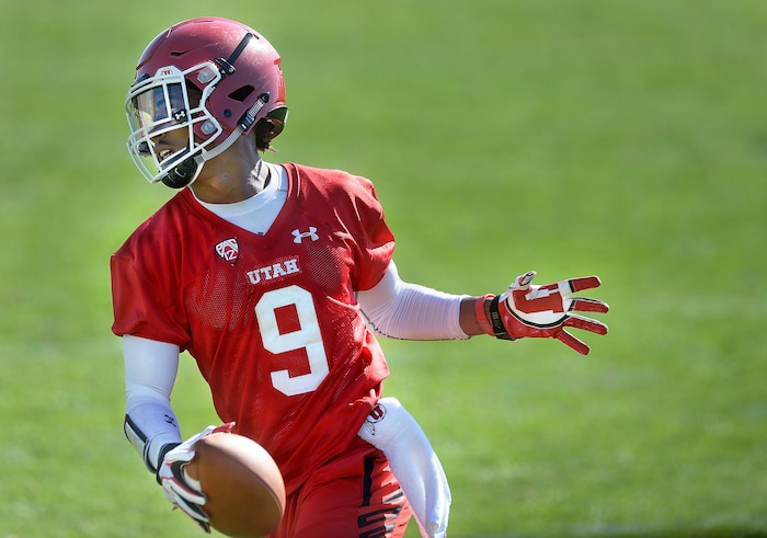 Scott Sommerdorf | The Salt Lake Tribune
WR Darren Carrington II runs after a catch during the first day of Utah fall football camp, Friday, July 28, 2017.