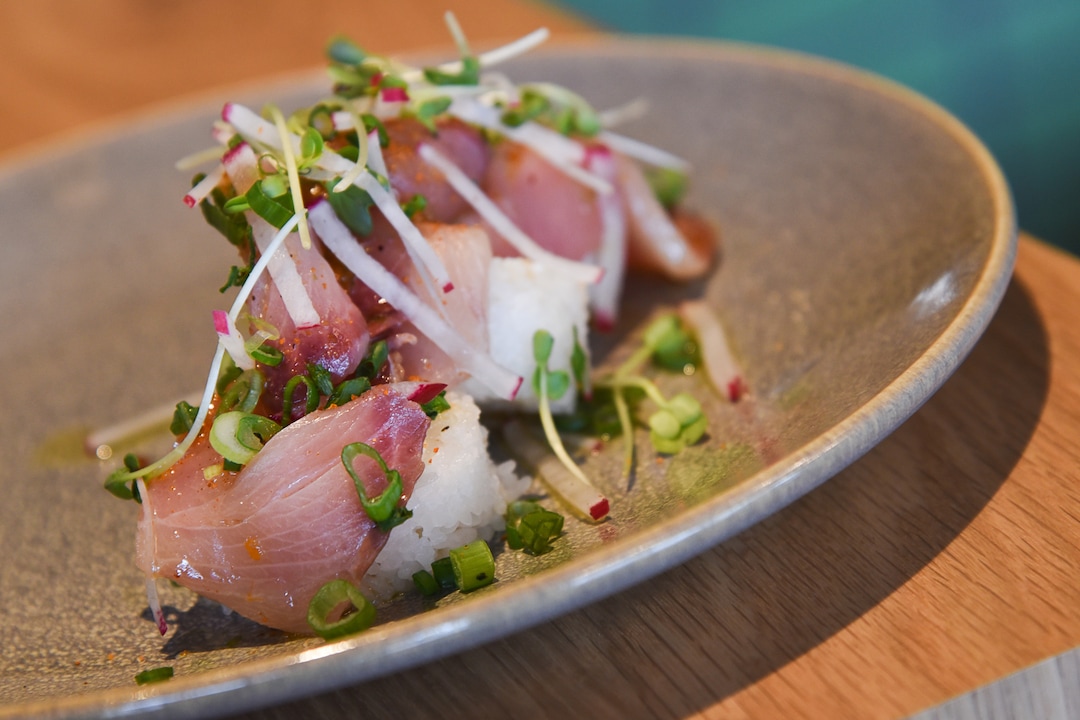 (Francisco Kjolseth  |  The Salt Lake Tribune)  Hamachi crudo with chile, lime, scallion, white soy, and toasted sushi rice cake at Hearth & Hill a new restaurant in Kimball Junction that serves upscale comfort food at 1153 Center Drive in the Newpark Retail Center is one of the new restaurants available to try before (or after) the Sundance Film Festival. 