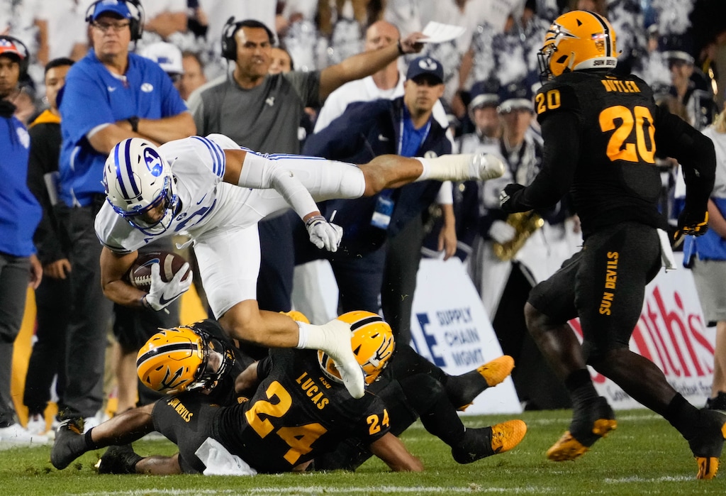 (Francisco Kjolseth | The Salt Lake Tribune) Brigham Young Cougars fullback Masen Wake (13) is taken down by the Arizona defense in football action between the Brigham Young Cougars and the Arizona State Sun Devils at LaVell Edwards Stadium in Provo, on Saturday, Sept. 18, 2021.