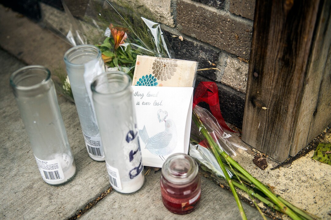 (Chris Detrick  |  The Salt Lake Tribune)   Flowers, cards and candles are left outside of Big Ed's, 210 University Street, in Salt Lake City Tuesday, September 19, 2017. 