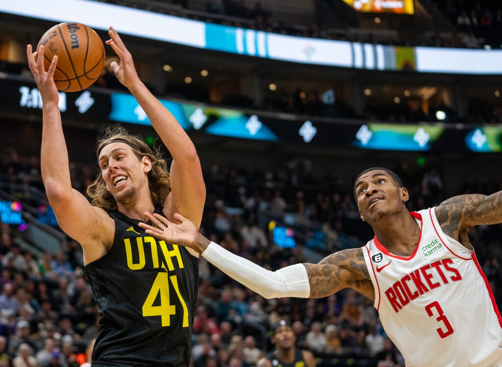 (Rick Egan | The Salt Lake Tribune) Utah Jazz forward Kelly Olynyk (41) grabs a rebound over Houston Rockets guard Kevin Porter Jr. (3), in NBA action between the Utah Jazz and the Houston Rockets, at Vivint Arena, on Wednesday, Oct. 26, 2022.