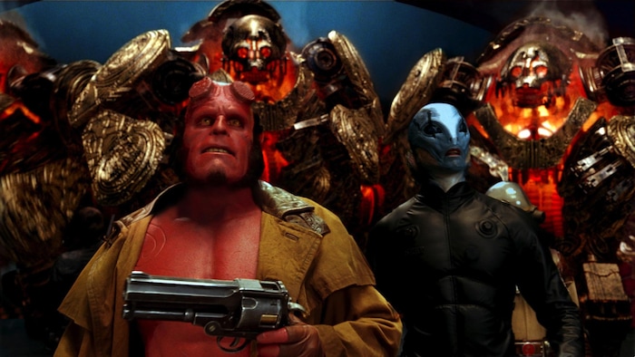 (Courtesy Universal Pictures) Hellboy (Ron Perlman, left) and Abe Sapien (Doug Jones, right) face a bunch of world-destroying robots in the 2008 action thriller "Hellboy II: The Golden Army."