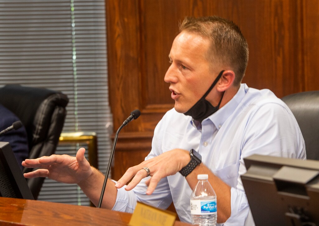 (Rick Egan  |  The Salt Lake Tribune file photo) Commissioner Tanner Ainge tells residents that they are doing exactly what they were not supposed to be doing, by overcrowding the room, and called for a vote to adjourn Utah County Commission meeting. The group protesting against masks being required in schools removed the social distancing tape on the chairs and filled the Utah County Commission room to over flowing, prompting the vote to adjourn the meeting in Provo, on Wednesday, July 15, 2020.
