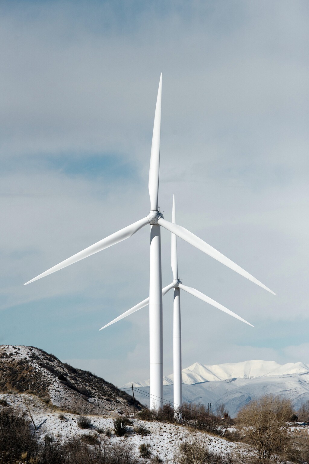 (Brandon Thibodeaux | The New York Times)

Wind turbines near Spanish Fork, Utah, on Feb. 8, 2019. "Recovery from the pandemic should be only the start; we need a strategy to cure our longer-term problems of sluggish productivity growth and weak private demand," writes New York Times columnist Paul Krugman, "Large-scale public investment, whether or not it looks like some people’s idea of infrastructure, is the way forward."