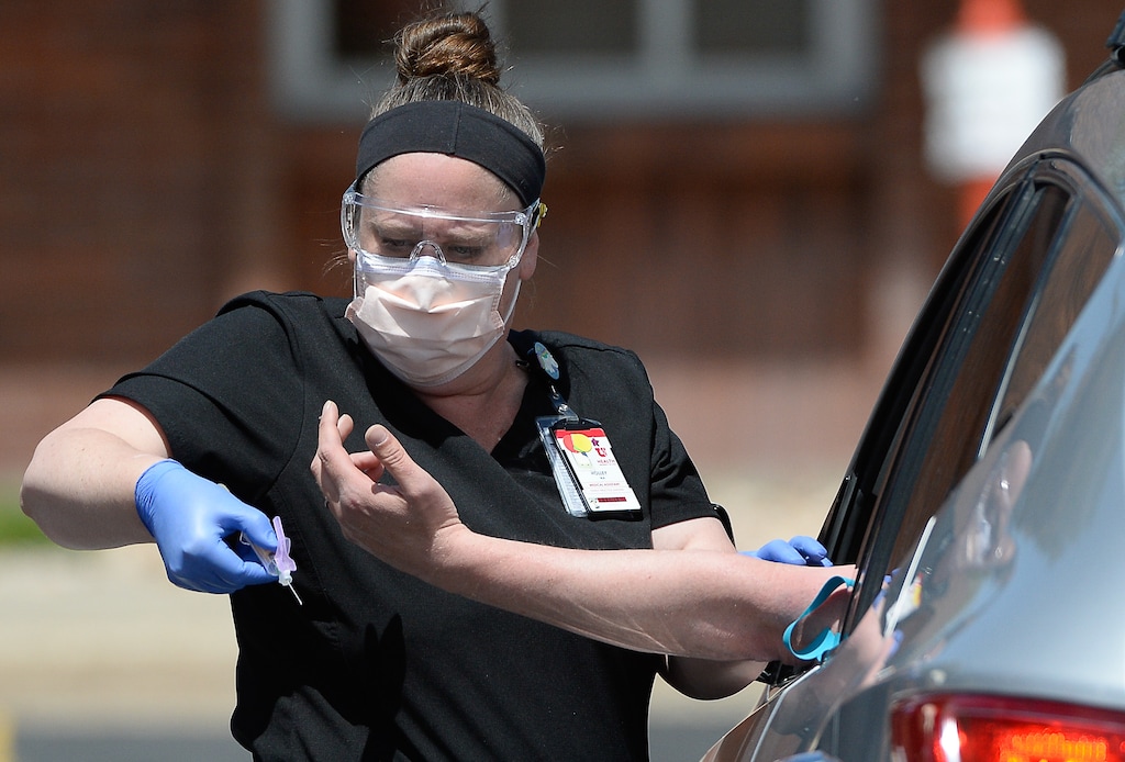 (Francisco Kjolseth | The Salt Lake Tribune) Medical assistant Holley Bryan performs a blood draw to test for coronavirus antibodies in Park City on Wednesday, May 6, 2020, as part of the Utah HERO (Health & Economic Recovery Outreach) program. The massive undertaking will begin with randomized testing of 10,000 Utahns across four counties. The data gathered will inform decision-makers in the state as they work to help keep residents safe and get people back to work.